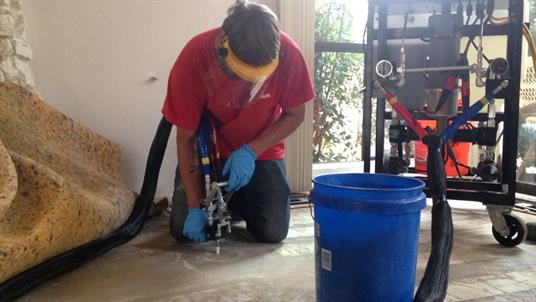 POLYURETHANE FOAM being injected into foundation